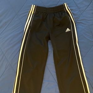 Black and white adidas track pants